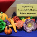 A photo of vegetable and bread carvings by 'Garde Manager Class'